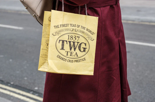 Mustard yellow leather bucket bag with 1837 TWG Tea logo